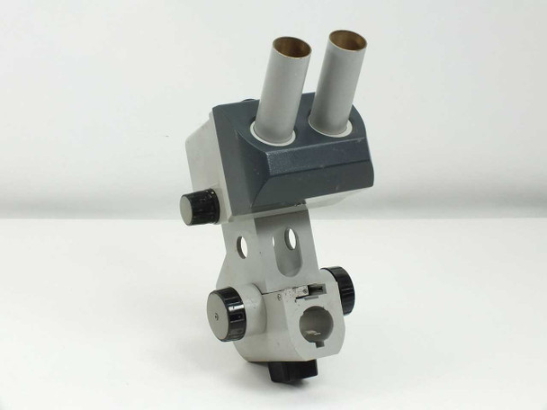 Zeiss Stemi SV8 stereo microscope head with focus block — front-left three-quarter view showing dual eyepiece tubes and focus knobs