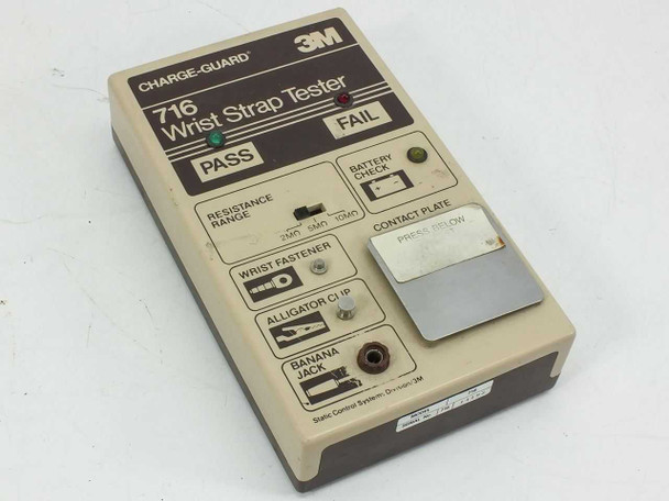 3M Charge-Guard 716 Wrist Strap Tester — front panel showing PASS and FAIL LEDs, resistance range selector, wrist fastener, alligator clip, banana jack inputs, and contact plate