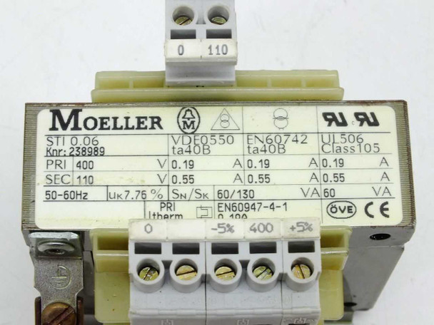 Moeller STI 0.06 rating plate close-up — shows 400V primary, 110V secondary, 60VA, 50-60Hz, Uk 7.76%, Class 105, VDE0550, EN60742, UL506 certifications