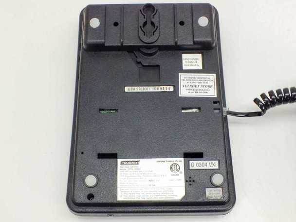 Teledex OPAL 2011S bottom/base view showing wall-mount keyway, label stickers, date code 6.0304 VXI, and coiled cord port