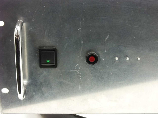 Wavetek 130 function generator — close-up of front panel left section showing black rocker power switch with green LED indicator and red push-button indicator, with surface scratches visible on panel