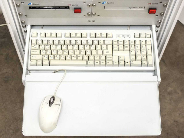 Suntek EPS rack slide-out keyboard tray fully extended — full-size dual-language keyboard and PS/2 mouse