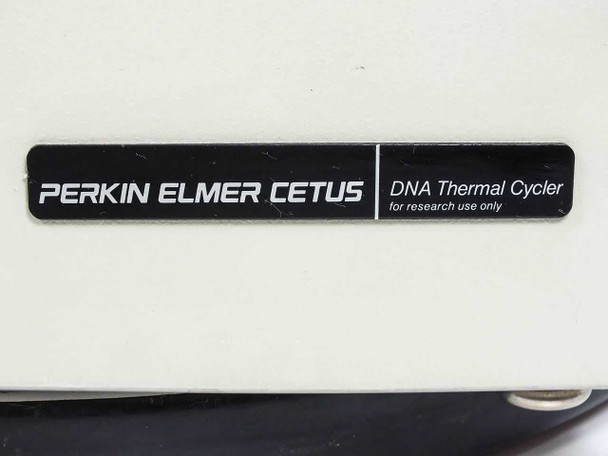 Perkin-Elmer Cetus DNA Thermal Cycler — close-up of front nameplate badge reading 'PERKIN ELMER CETUS — DNA Thermal Cycler — for research use only'