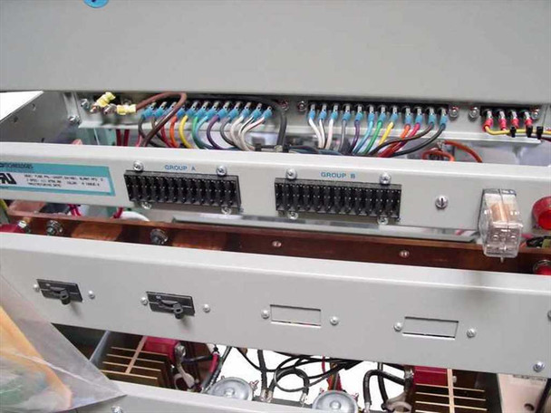 Interior wiring view of AGM25L-1 showing Group A and Group B terminal blocks with multicolor wire harness and relay