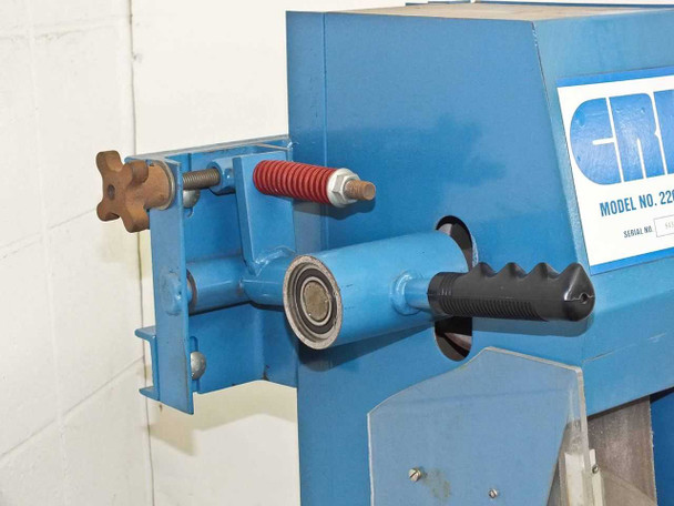 CRL 2200RP roller platen close-up showing tension adjustment knob, red spring tensioner, bearing roller, and black lever handle