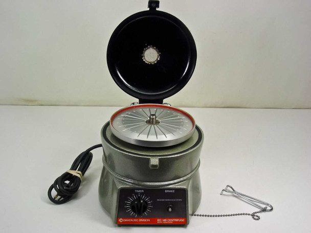 IEC MB Micro Hematocrit Centrifuge lid open — aluminum 24-slot rotor visible with red safety gasket on lid rim, front control panel and capillary holder tool shown