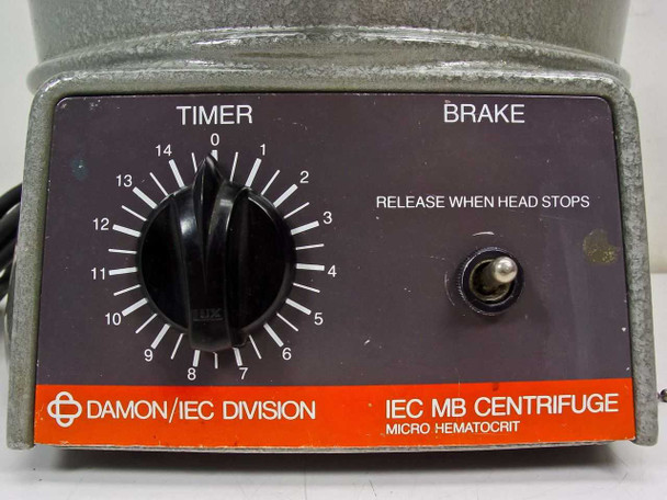 IEC MB Centrifuge front control panel close-up — TIMER dial (0–14 minute graduations), BRAKE button with 'Release When Head Stops' text, Damon/IEC Division label