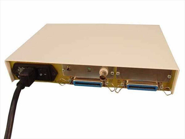 ida-FLEX 940003 rear panel showing two Centronics parallel ports, BNC connector, IEC power inlet, and power switch with attached power cable