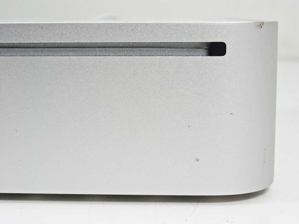 Apple Mac Mini A1176 front panel showing slot-load optical drive and aluminum enclosure with minor surface marks