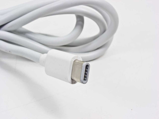 Apple AC adapter DC connector end close-up showing barrel connector tip