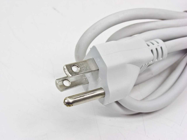 Apple Mac mini power cord close-up showing standard three-prong US AC wall plug