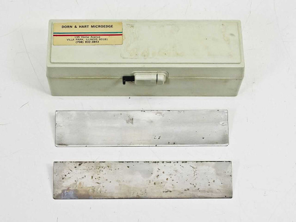 Dorn & Hart Microedge blade case (Villa Park, Illinois) with two 185mm C-profile microtome blades showing use wear
