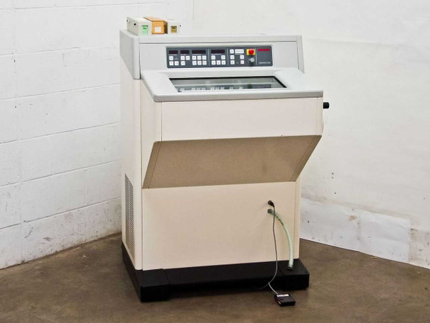 Microm HM500 OM cryostat microtome – front-left three-quarter view with foot pedal and small accessory box on top