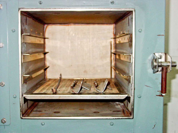 Hotpack 733 interior chamber — four shelf rack positions, metal shelf racks installed, stainless interior with some discoloration from use