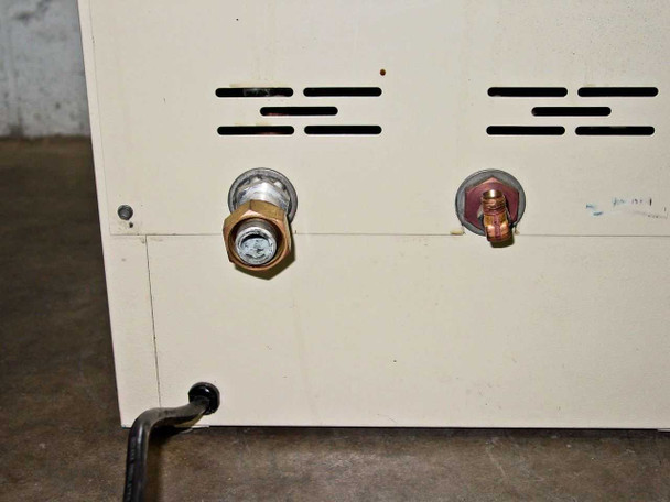 Precision Scientific Model 19 Vacuum Oven rear panel close-up showing two brass vacuum fitting ports and ventilation slots