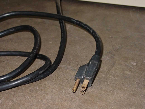 Precision Scientific Model 19 Vacuum Oven power cord close-up showing standard 3-prong plug with light surface oxidation on prongs