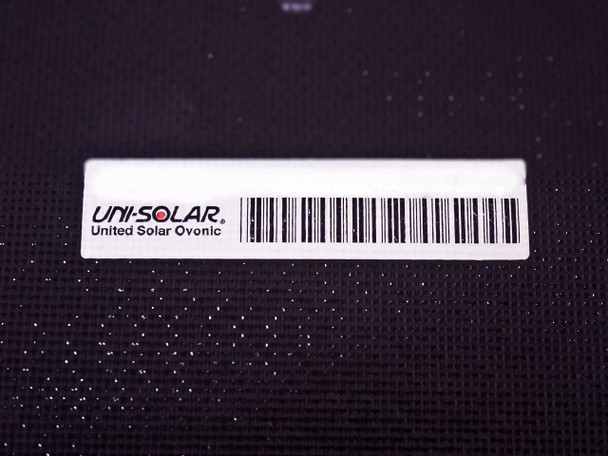 Uni-Solar United Solar Ovonic product label with barcode on dark surface of the PVL-128 laminate