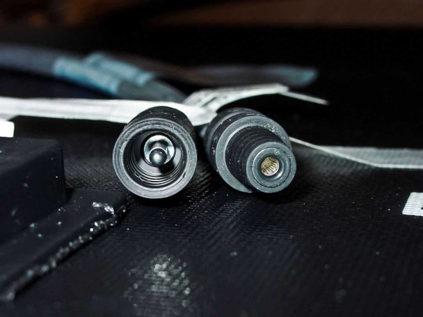 Close-up of Uni-Solar PVL-136 quick-connect (QC Universal) male and female connector ends