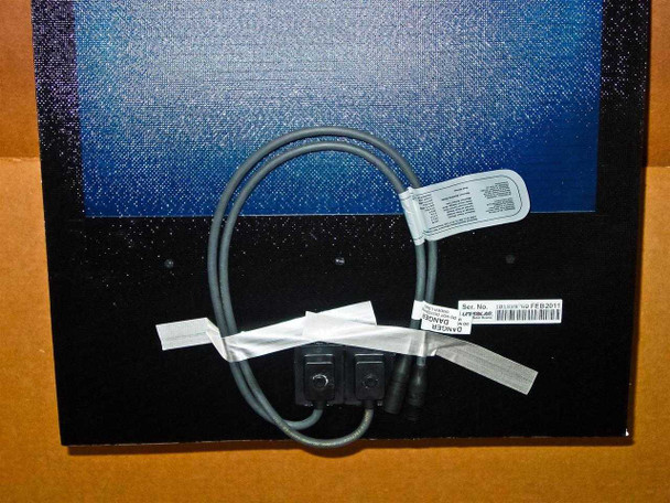 Uni-Solar PVL-136 flexible solar panel rear showing output lead cable with quick-connect connector, serial number label, and barcode tag