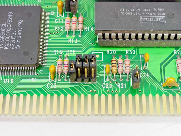 Close-up of Trident TVGA8900CL PCB showing jumper block, resistors, Quadtel BIOS chip, and ISA edge connector traces