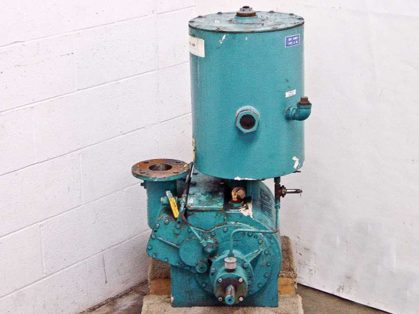 Kinney KDH-130 high vacuum pump – right-side view showing flanged port at left, cylindrical oil separator with label on top, discharge port at right, shaft end and pallet