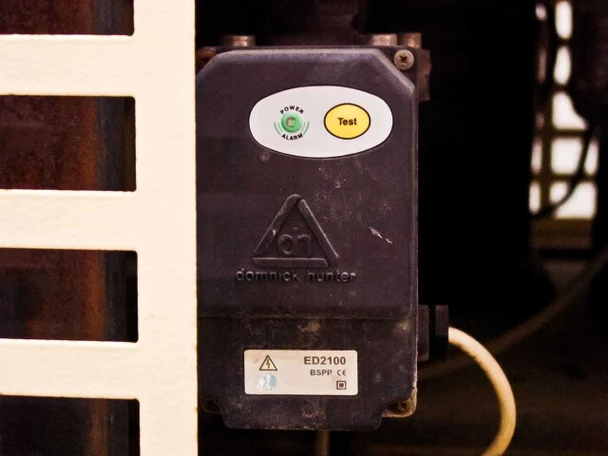 Domnick Hunter ED2100 BSPP electronic condensate drain module on TMS 0140 showing Power/Alarm indicator and Test button