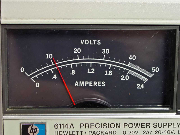 HP 6114A Precision Power Supply — close-up of dual-scale analog panel meter showing Volts (0–50) and Amperes (0–2.4) scales