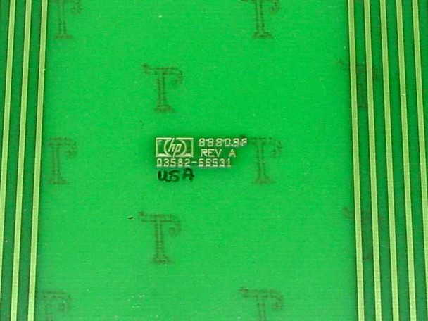 HP 03582-66531 extender board close-up — HP logo stamp reading '88809F REV A / 03582-66531 / USA A' on green PCB