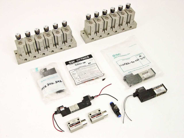 Full SMC ARM2000 assembly lot overview — two manifold banks, solenoid valves, air valves, fittings, and flow controller