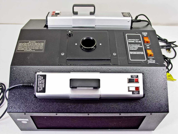 Spectroline CC-80 top-down overview showing lens port, control panel, lamp unit on top, UV window at front, and side power connections