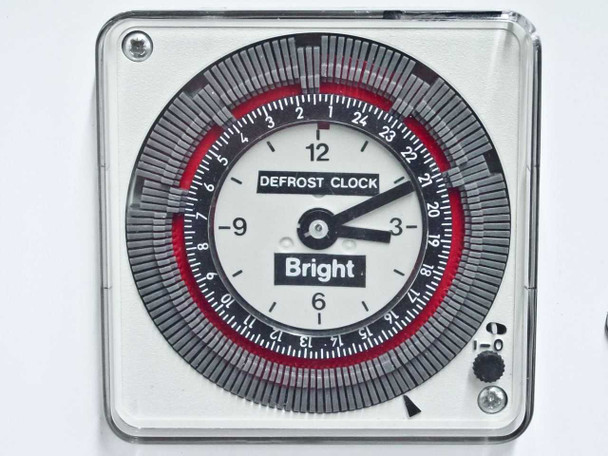 Bright Instrument defrost clock close-up showing 24-hour programmable analog timer dial with Bright logo