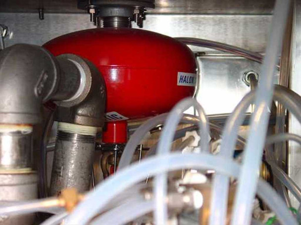 FSI 2134N internal view showing red Halon fire suppression canister integrated within the chemical plumbing system