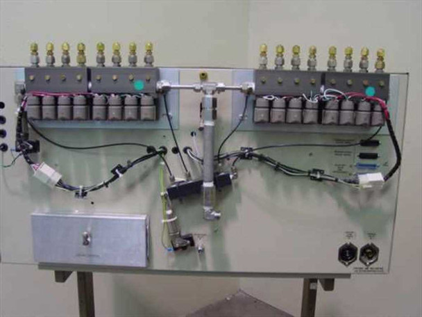 Telos Labs 650 System rear gas manifold panel showing dual banks of solenoid valves, gas fittings, and interconnect wiring