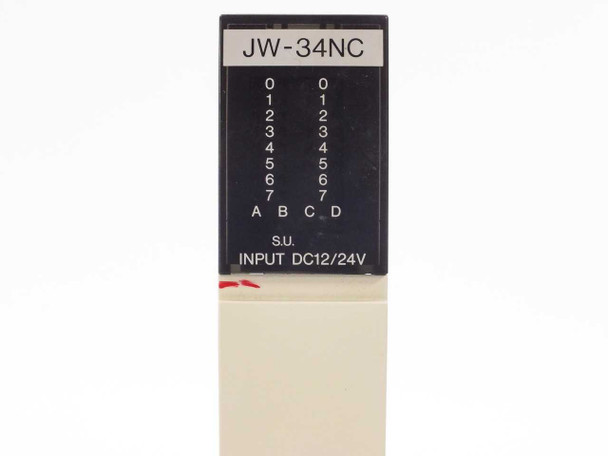 Sharp JW-34NC module label closeup – model number, S.U. designation, INPUT DC12/24V, 8-point group layout A B C D