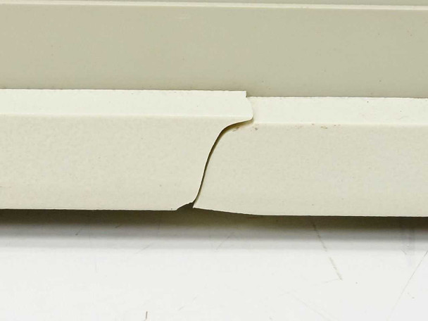 HP 9121D cracked faceplate close-up — crack running across the lower front panel
