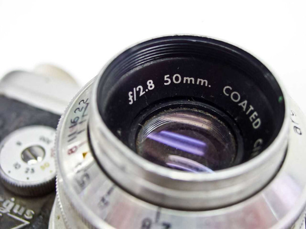 Close-up of Argus Coated Cintar lens barrel showing f/2.8 50mm COATED markings and coated glass element