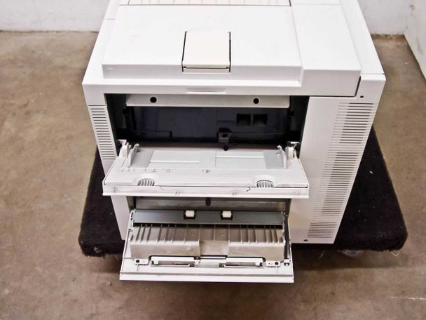 HP LaserJet 5Si MX — top view with output tray extended and multipurpose tray open at front