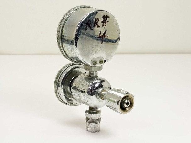 Welco R50 vacuum regulator rear and side view showing outlet port and chrome body with handwritten inventory mark