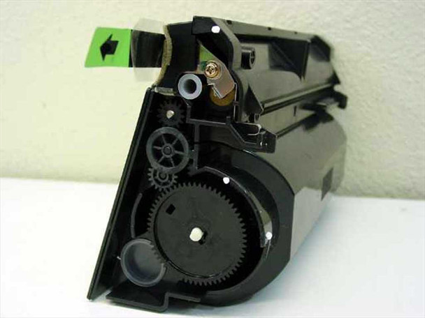 Sharp FO-48ND toner cartridge – opposite end view showing internal gear train and toner compartment with green tab visible