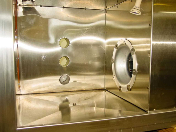 Hanse TC-1 stainless steel interior chamber — 24x24x24 inch interior showing two round access ports on left wall, large circular port fitting on right, and interior light