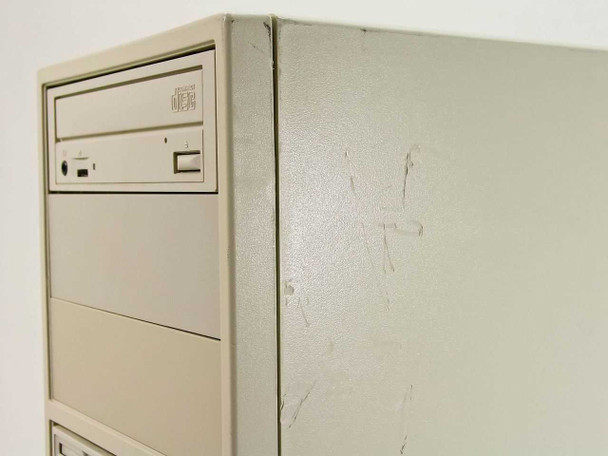 Dell Dimension XPS P90 — right side of tower showing scratches and scuff marks on the upper panel surface