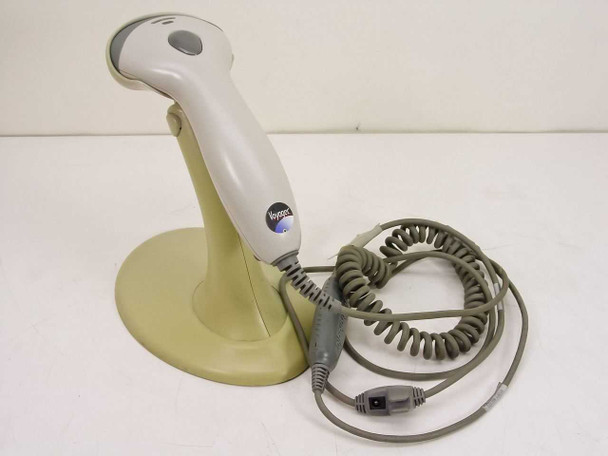 Metrologic MS9540 Voyager CG barcode scanner seated in stand with coiled cable and RS232 connector visible