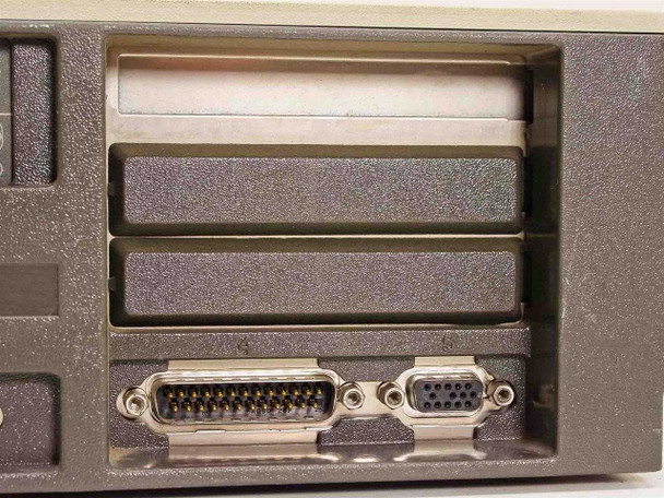 IBM PS/2 Model 30 rear expansion area showing two open slot covers and DB-25 plus DB-9 connectors