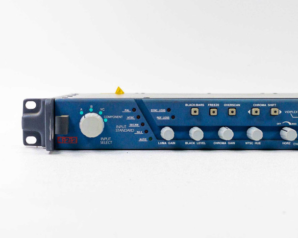 Snell & Wilcox TBS24 — close-up of left front panel showing Input Select rotary switch, Input Standard selector (PAL/NTSC/SECAM/Auto), Sync Loss and Ref Loss LEDs, Luma Gain, Black Level, Chroma Gain, and NTSC Hue knobs