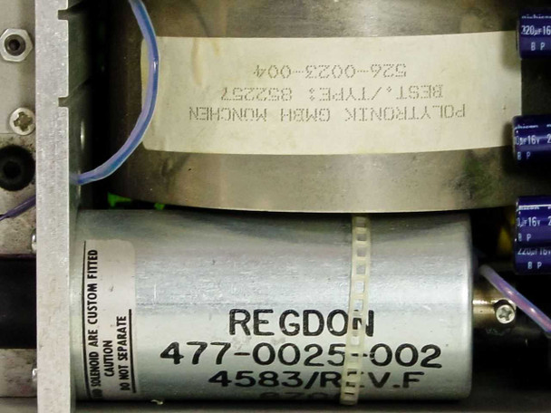 Close-up of IT Delta internal components: Polytronik GmbH München transformer (Type 852257, P/N 526-0023-004) and Regdon motor (477-0025-002, 4583/Rev F) with solenoid assembly