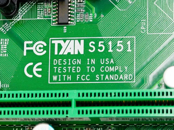 Tyan S5151 PCB silkscreen label close-up showing model number, FCC and CE certification marks, and Designed in USA text