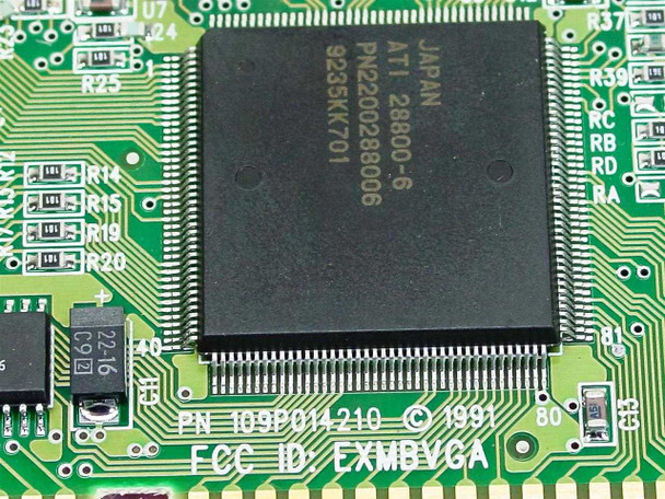 Close-up of ATI 28800-6 GPU chip on 109P014210 ISA VGA card showing chip markings PN22002880006 and FCC ID EXMBVGA silkscreen