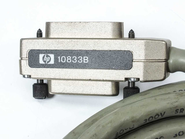 HP 10833B GPIB cable — close-up of one connector end showing HP logo, model number label, and knurled thumb-screw locking hardware