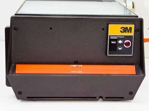 3M 213 Overhead Projector – front panel with 3M label, power switch, indicator light, and orange film transport tray