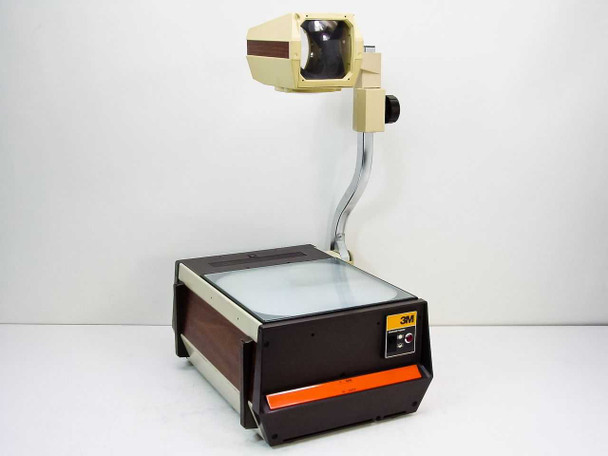 3M 213 Overhead Projector full view – cream and brown body with orange accent strip, projection head on chrome arm